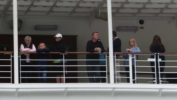 Passengers of the Emerald Princess cruise ship wait patiently while the FBI interviewed witnesses.