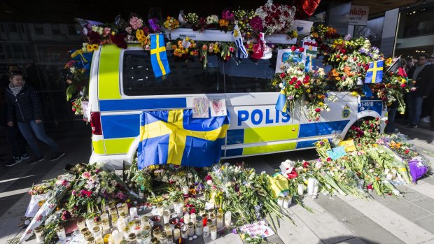 Flowers are left on a police car to show their gratitude to law enforcement officers following the truck attack in April.