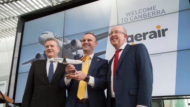 Tigerair Australia chief executive Rob Sharp, left, Chief Minister Andrew Barr and Capital Airport Group managing director Stephen Byron announce the return of?Tigerair flights between Melbourne and Canberra.