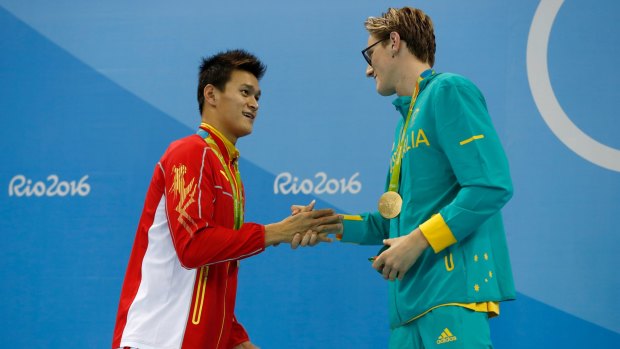 No love lost: Sun Yang and Mack Horton shake hands after the medal presentation.