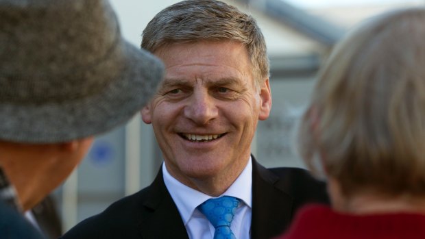 New Zealand Prime Minister Bill English talks with supporters at an event in Christchurch.