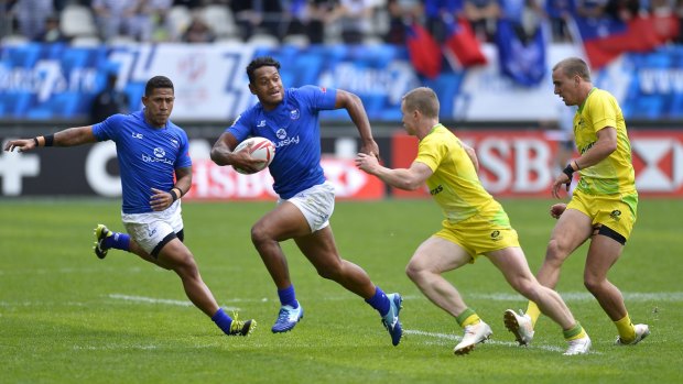 Tomasi Alosio runs the ball for Samoa against Australia in the rugby sevens in Paris on Saturday.