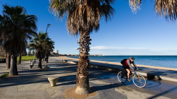 St Kilda beach is almost abandoned as the wind begins to pick up around the bay on Monday.