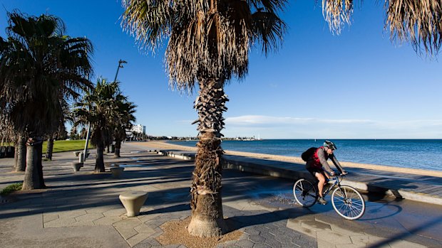 St Kilda beach is almost abandoned as the wind begins to pick up around the bay on Monday.