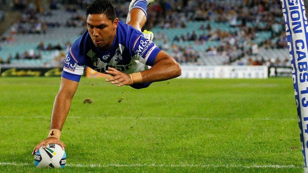 Flying high: Bulldogs winger Curtis Rona doing what he does best.