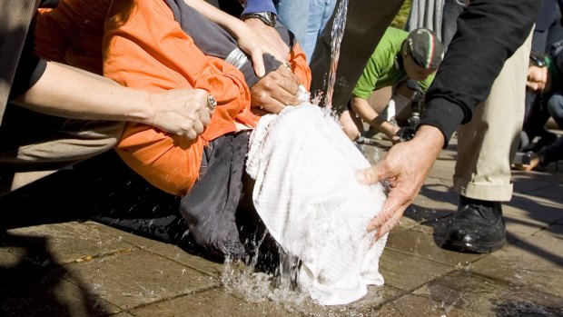 Water-boarding is simulated by protesters outside the US Justice Department in 2007. 