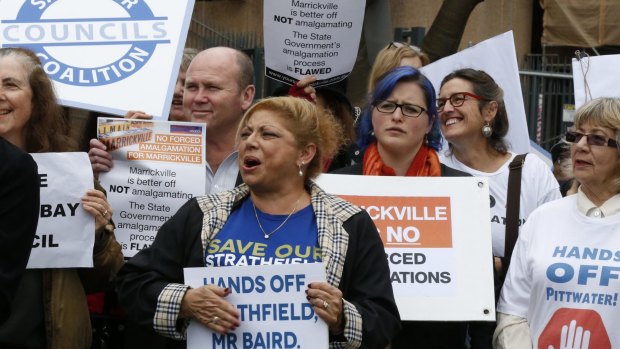 Protesters rally against forced amalgamations.