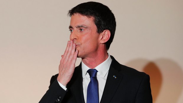 Former socialist Prime Minister Manuel Valls blows a kiss to supporters after conceding defeat.