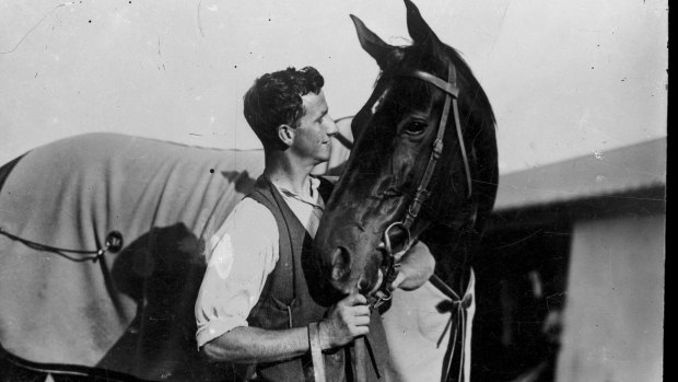 Gunman's target: Strapper Tommy Woodcock and the legendary Phar Lap.