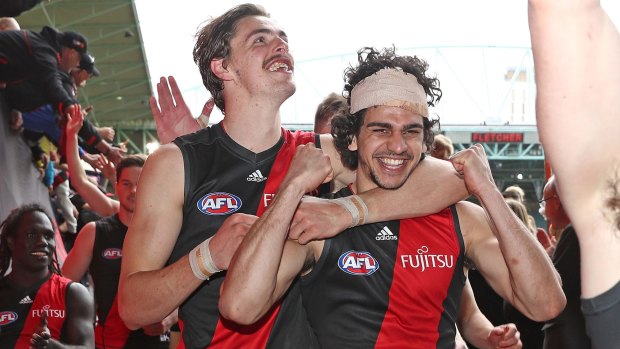 Joe Daniher and Jake Long celebrate after the game.