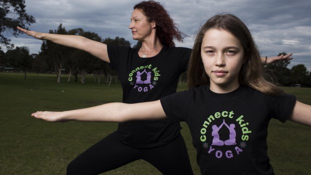 Molly and her mum Cynthia Levin do some yoga in Henley Park in Enfield. 