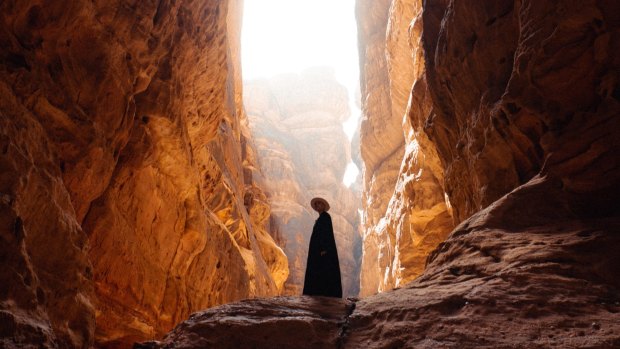 Emerging from the shadows ... Saudi women are out in public interacting with visitors.