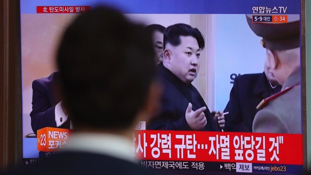 A man in Seoul watches file footage of North Korean leader Kim Jong-un. 