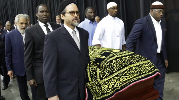 Muhammad Ali's casket is escorted by pallbearers, including (far left) Yusuf Islam, the singer formerly known as Cat Stevens.