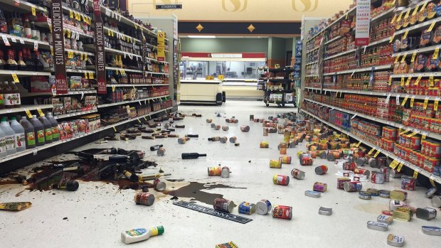 Grocery items litter the aisles inside a supermarket following the earthquake.