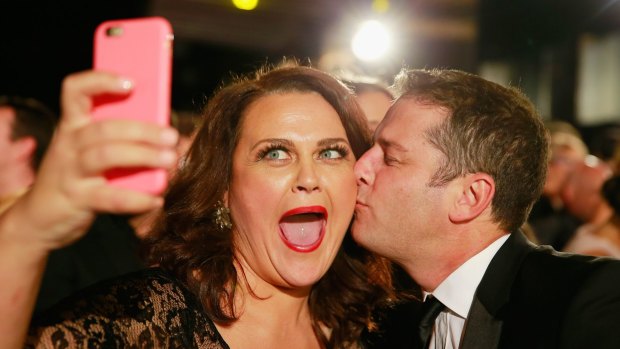 Selfie time ... Karl Stefanovic kisses Chrissie Swan as she takes a selfie at the Logie Awards in May.