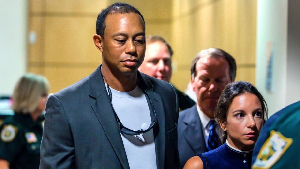 Tiger Woods leaves the Palm Beach courthouse.