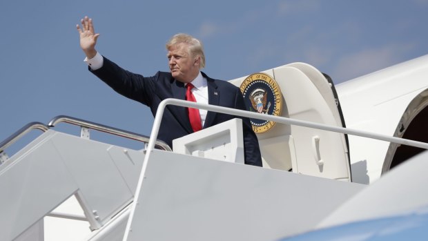 US President Donald Trump boards Air Force One en route to New Jersey to begin his summer vacation. The White House will this week officially notify the UN of its intention to leave the Paris climate accord. 