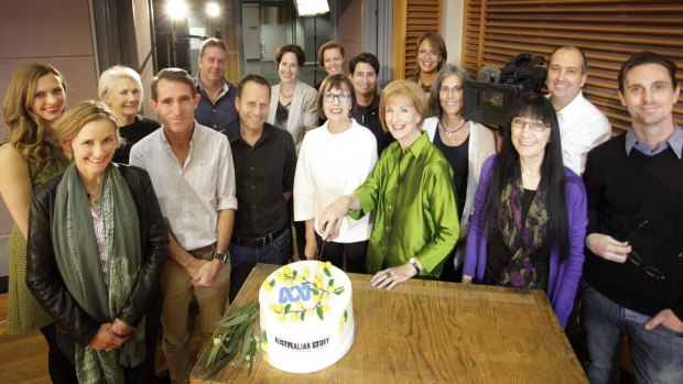 Caroline Jones (centre in green) with some of the <i>Australian Story</i> team as they celebrate 20 years of the show.