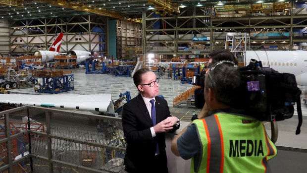 Alan Joyce at the Seattle factory that where the new Qantas Dreamliner, seen behind him, is being constructed.