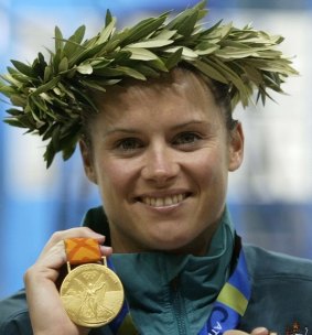 Olympic diver Chantelle Newbery shows off her gold medal in Athens in 2004.