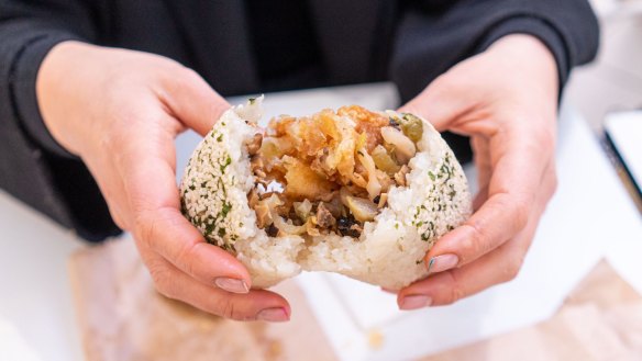 Glutinous rice log stuffed with youtiao (Chinese doughnut) and pickled mustard greens at Blissful Station. 