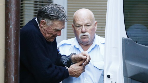 Ian Turnbull is escorted out of court