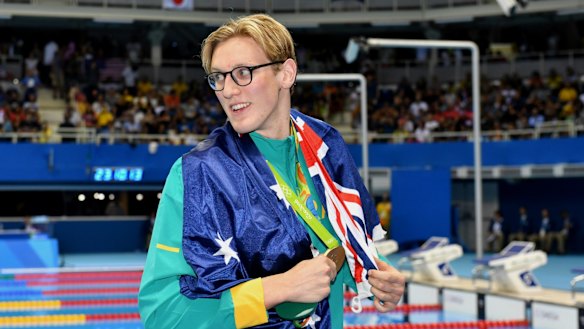 Mack Horton shows off his gold medal.