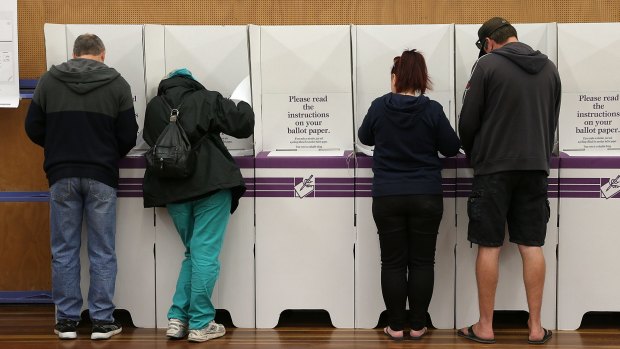 Australians cast their vote at a booth during the July 2 election.
