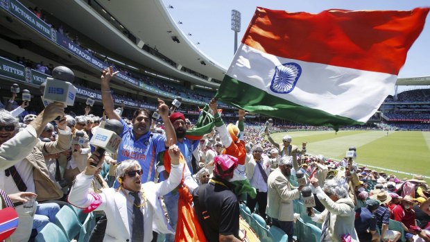 United in cricket: The Swami army and the 'Richies' dance together on day two of the Sydney Test.