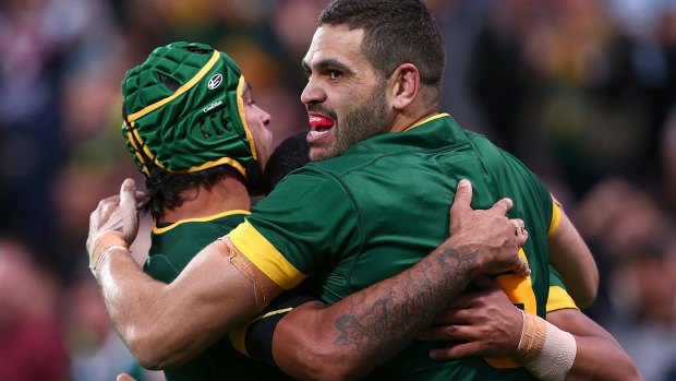 Another try: Johnathan Thurston, Greg Inglis and Valentine Holmes celebrate. 