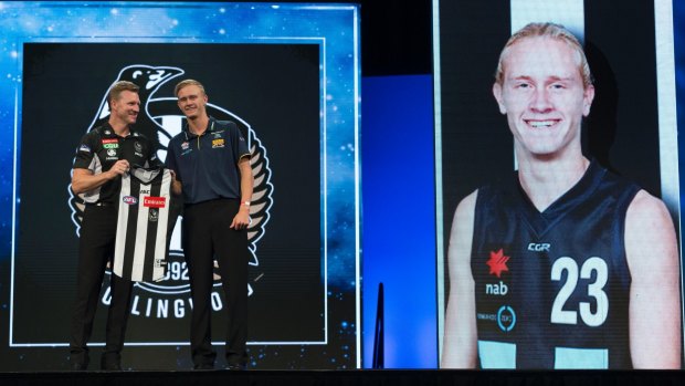 Jaidyn Stephenson is welcomed by Pies coach Nathan Buckley.