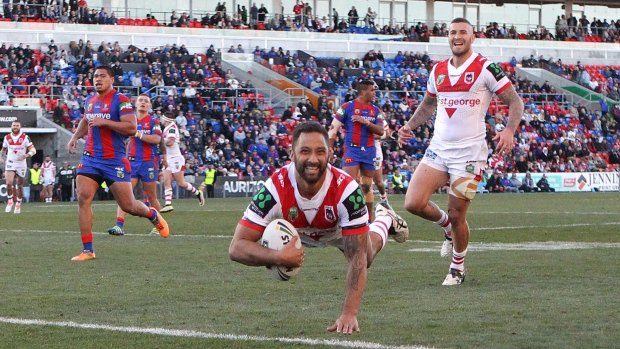 Magic touch returns: Benji Marshall scores during his star turn for the Dragons against Newcastle at Hunter Stadium.