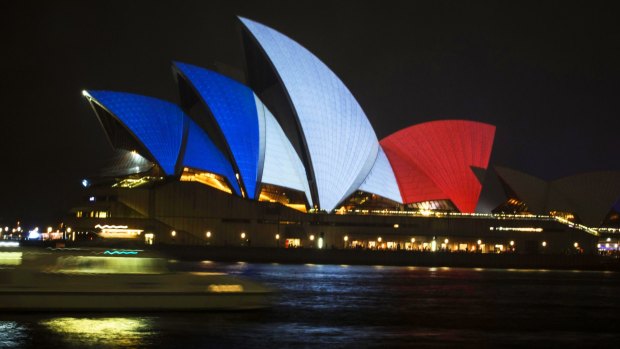 The Sydney Opera House lit up in red, white and blue.