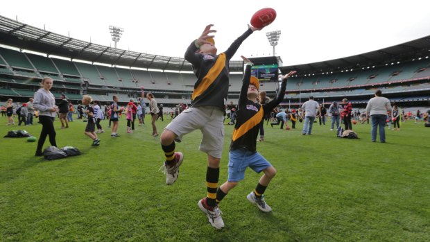 Kids enjoy the chance to kick on at the MCG earlier this year.