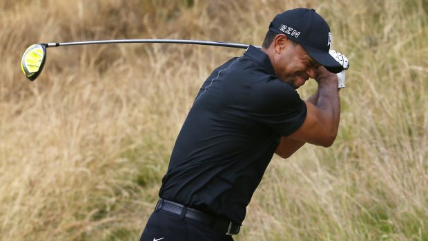 Not happy: Tiger Woods reacts to his tee shot on the eighth hole.