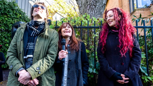 L-R: Brother Harry Howard, partner Genevieve McGuckin and sister Angela Howard speaking at the unveiling of Rowland S Howard laneway in St Kilda. 