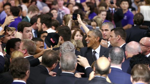 Responsive: US President Barack Obama greets audience members after his speech at the University of Queensland.