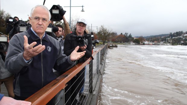 Prime Minister Malcolm Turnbull at the flooded Tamar River and the levee in Launceston.