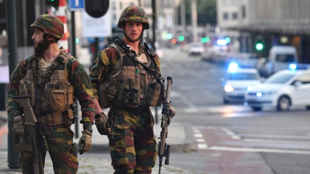 Belgian Army soldiers patrol outside Central Station after a reported explosion in Brussels on Tuesday.