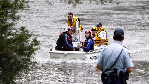 Police and emergency crews search the Murrumbidgee River on Wednesday afternoon.