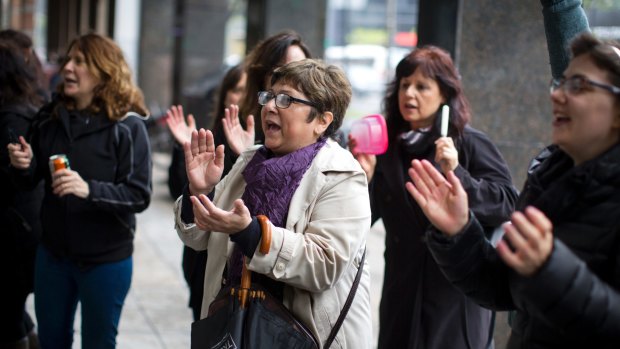 Women chant slogans as they participate in a one-hour strike outside their workplace to protest violence against women in Buenos Aires, Argentina on Wednesday.