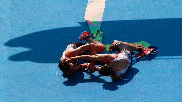 Brothers-in-arms: Alistair and Jonathan Brownlee celebrate after winning the triathlon.