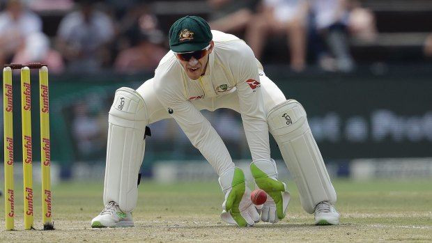 Australia's captain Tim Paine receives the ball on during day one of the fourth cricket test match between South Africa and Australia in Johannesburg, South Africa.