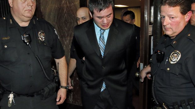 Daniel Holtzclaw cries as he is led from the courtroom.