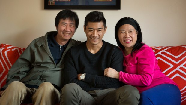 Lin Jong with his parents Vitor and Fay. 
