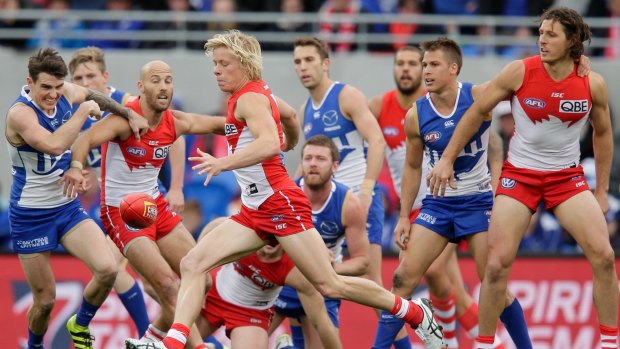 Breaking free: Isaac Heeney emerges from the pack.