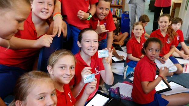 Coogee Public School students with the new Opal card to be rolled out next year