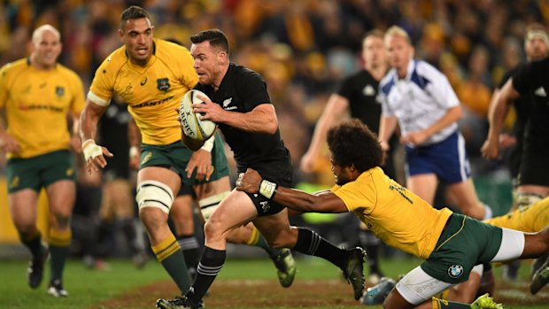 Too easy: Ryan Crotty makes a break through the threadbare Australian defence.