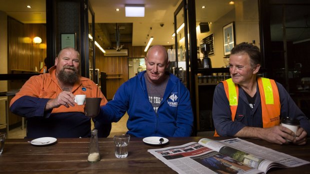 Construction workers (from left) Ron Horn, David Jones and Theo Argyros having early morning coffee before  work, at Spriga Espresso Bar on King Street, Melbourne. 
